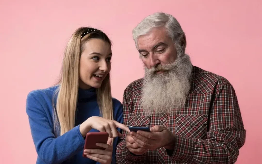 young female hold a phone and pointing to phone of older man.