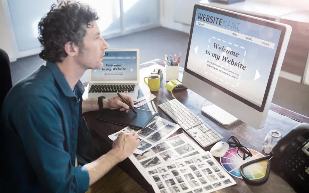 man working on computer building his own website