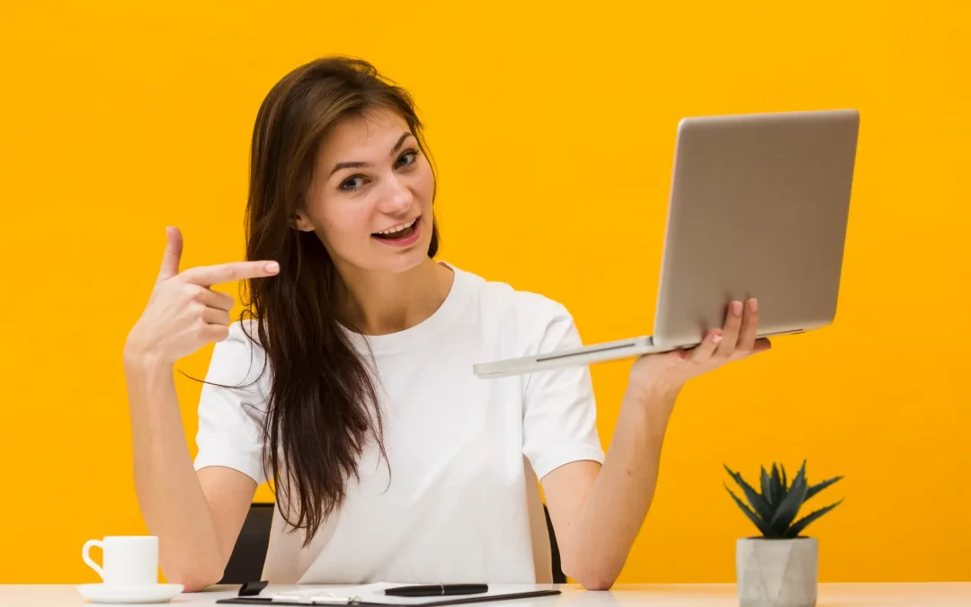 woman pointing to laptop